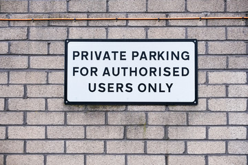 Fototapeta na wymiar Private parking authorised users only sign
