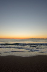 Fototapeta na wymiar Sunrise on a beach of the mediterranean sea