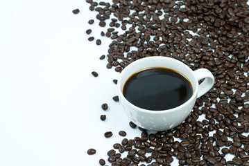 cup of coffee with beans on white background