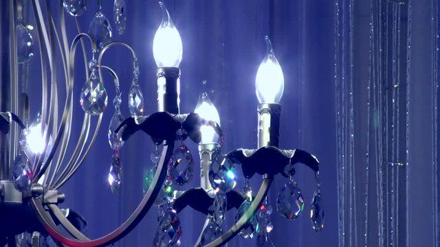 Luxury chandelier with pendants. Vintage lighting device.