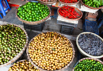tropical spices and fruits sold at a local market in Hanoi (Vietnam)