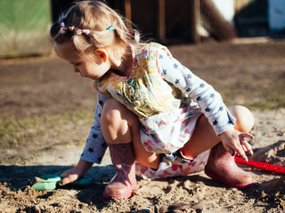 child playing with sand