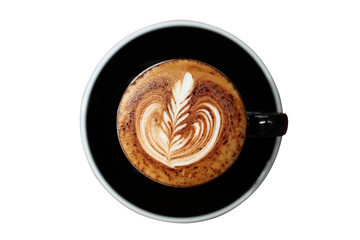 Hot cappuccino with latte art in black cup isolated on white background