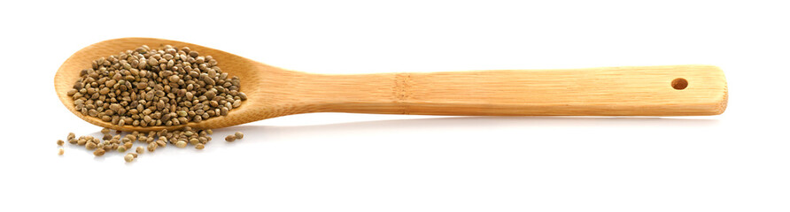 Hemp seed. Wooden spoon with hemp. Food additive. Isolated on white background. Cannabis.