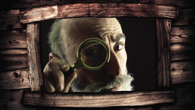 Seen from the window of a wooden cabin: a man looking at the camera with a magnifying lens (a detective / private eye), searching for valued information.