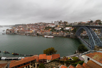 Fototapeta na wymiar View of the city from Incredible Ponte da Arrábida bridge in Porto, Portugal
