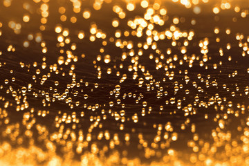 Many beautiful water droplets on the web, blur, Golden background