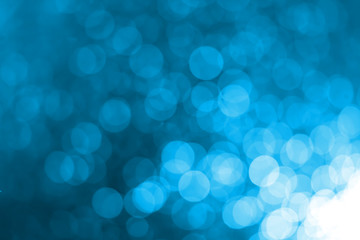 White bokeh on a blue background