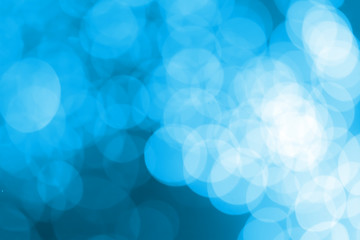 White bokeh on a blue background