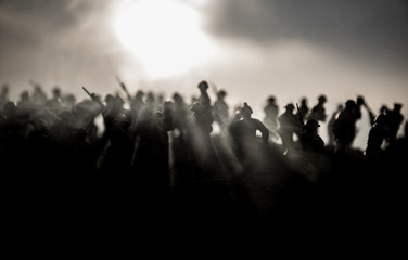 War Concept. Military silhouettes fighting scene on war fog sky background, World War Soldiers...