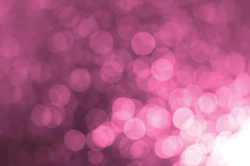 White bokeh on a pink background