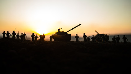 War Concept. Military silhouettes fighting scene on war fog sky background, World War Soldiers...