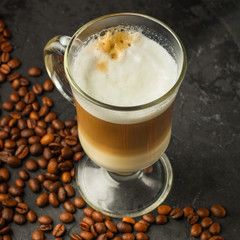 coffee fresh and hot in a white cup, aroma. serving of beverage (coffee grain). food. top view. copy space