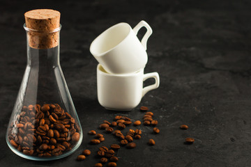 coffee fresh and hot in a white cup, aroma. serving of beverage (coffee grain). food. top view. copy space