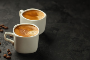 coffee fresh and hot in a white cup, aroma. serving of beverage (coffee grain). food. top view. copy space