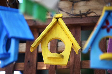 Obraz na płótnie Canvas close up of colorful wooden bird house background