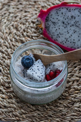 Chia pudding with pitahaya, pomegranate seeds and blueberries