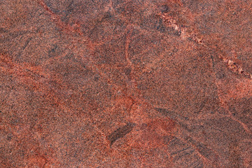 Texture Of Polished Red Brown Granite Close-up. Solid Red Stone Surface.
