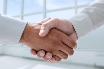 close up.reliable handshake of business people.