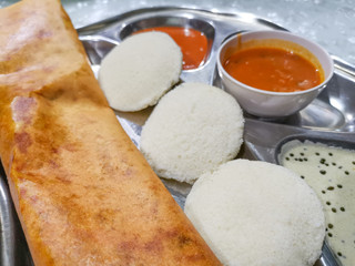 Masala Dosa and Idli Dosa food closeup with selective focus and crop fragment. It is a popular South Indian all time food