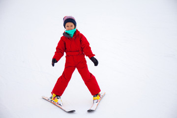 Fototapeta na wymiar Little girl training skiing