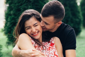 happy young couple in love on photoshoot in style of love story in the summer in nature
