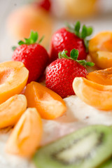 Strawberry, apricot and cream sponge cake. closeup.