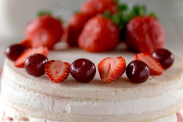 Cheesecake with sweet fresh cherry and strawberry. closeup.