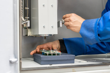 scientist wearing blue unifrom and use x ray or rontgen in laboratory b