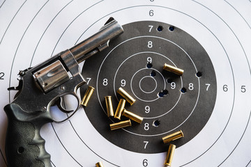 Pistol revolver with bullets and target
