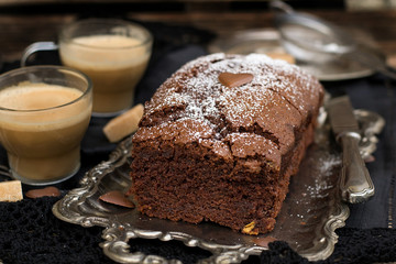 Homemade sweet cholocate cake with powdered sugar
