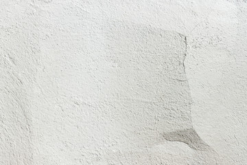 Concrete wall texture background. Old white wall with a crack