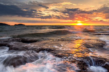 Wave hit the rock fog clouded the water stone the exposure twilight in the sea. beautiful sea rocks. 