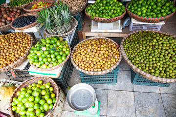 tropical spices and fruits sold at a local market in Hanoi (Vietnam)