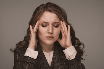 Health And Pain. Stressed Exhausted Young Woman Having Strong Tension Headache. Closeup Portrait Sick Girl Suffering From Head Migraine, Feeling Pressure And Stress.