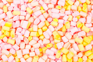 Marshmallow. Background of pink and yellow colorful mini marshmallows.