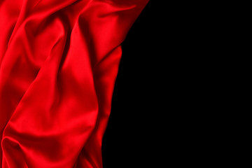 Red silk or satin luxury fabric texture can use as abstract background. Top view