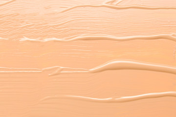 Liquid foundation texture. Make up for women. Top view.