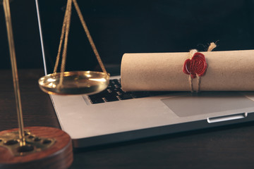 justice and law concept. Lawyer workplace with laptop and documents with dark wooden. Notary's...