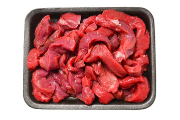 Raw veal slices in container isolated on white background.