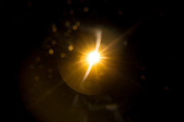 Abstract Natural Sun flare on the black background.
