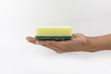 Hand in rubber glove holds color wash sponge on neutral background. The concept of bright spring, spring cleaning.