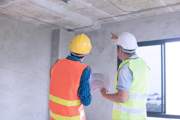 engineer inspector checking and introduce construction in building