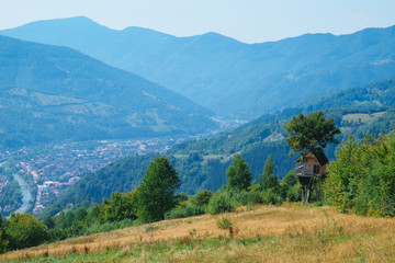 Tree House for kids with mountains at background, Carpathians, Eastern Europe