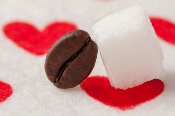 coffe bean and sugar on a heart backround