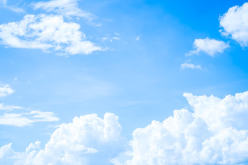 Naklejka na ściany i meble Clouds blue sky flying of white fluffy in daytime on clear summer day