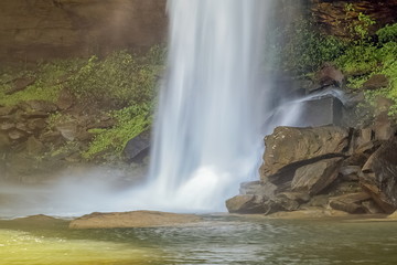 Huay Luang Waterfall, beautiful waterfall hitting on surface of arch rocks, Phu Chong Na Yoi National Park, Ubon Ratchathani, Thailand.