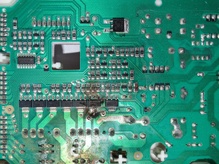Obraz premium Burnt Out Damaged Electrical Circuit Board