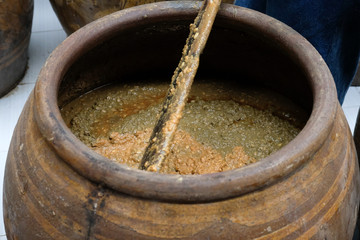 salted soybean paste in jar. soy miso production