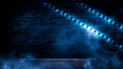 Illumination of an empty brick wall, neon light, smoke. The night scene of an empty room is decorated with abstract light. Night smoke.